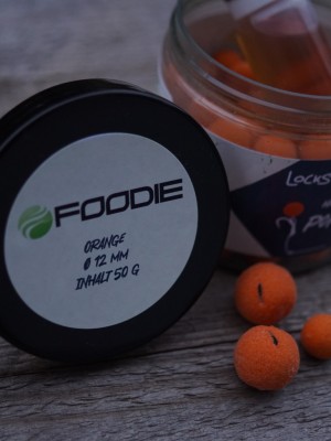 Die orangenen Foodie Pop Ups sind vollgepackt mit Attraktoren und Futterstimulanzien und passen dank des Trigga Shots perfekt zu unseren Foodie Boilies.